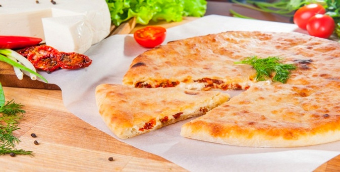 Пицца, осетинские пироги и подарки от службы доставки «Осетинские пироги Premium».